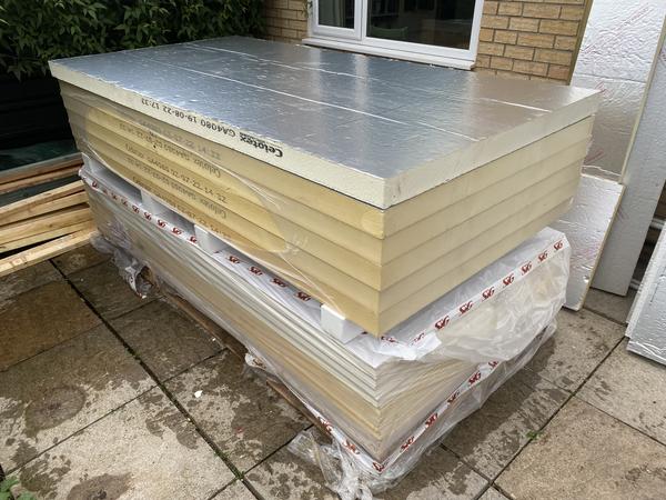 Materials pile: 80 mm PIR top and 37.5 mm insulated plasterboard bottom. A total of 13 80 mm sheets and 16 37.5 mm sheets were used.